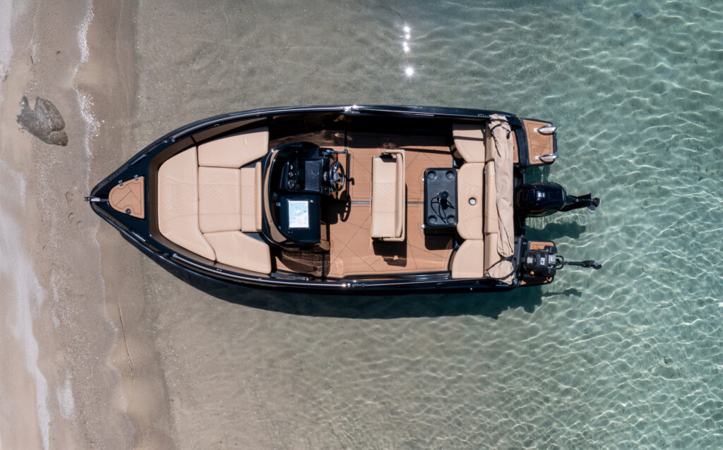 Aerial view of Black Swan boat near Diaporos Island, available for rent in Halkidiki.
